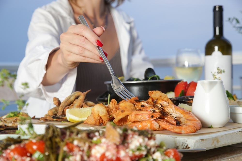 person eating seafood