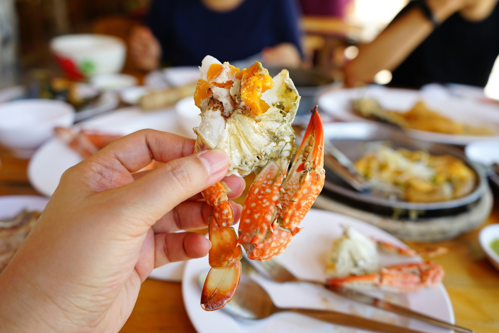 person eating seafood