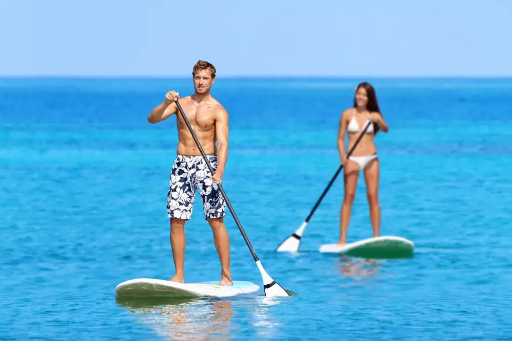 couple paddleboarding