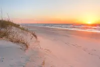sun rises over kure beach