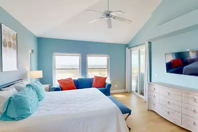 The primary suite is conveniently located on the first floor with an ocean view and en-suite full bathroom