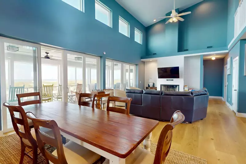 The dining table seats 6 with extra seating at the kitchen countertop and on the porch