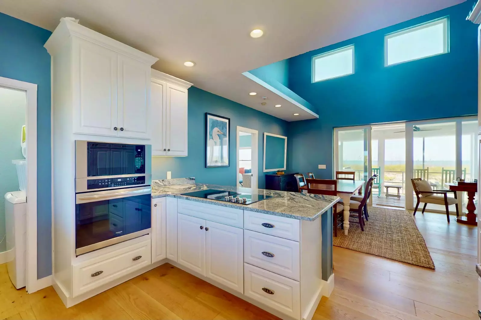 The kitchen opens to the dining area plus has additional countertop seating