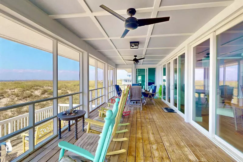 An expansive porch with rockers is the perfect place to relax and watch the sunrise or sunset!