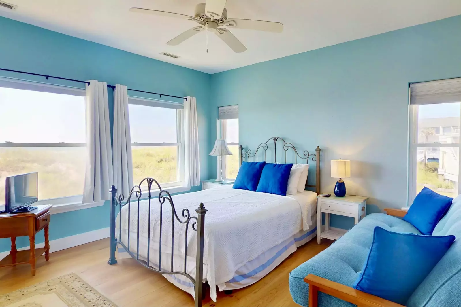 The second suite features ocean views, a queen bed, a fold out futon and an en-suite full bathroom