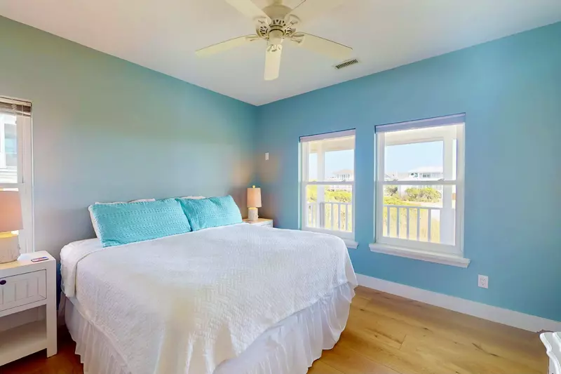 The third bedroom features a king bed and en-suite full bathroom