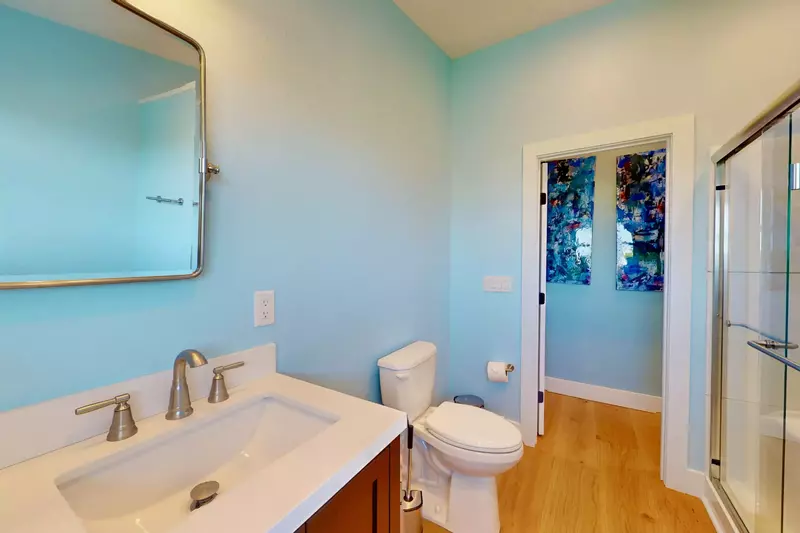 The loft full bathroom features a walk-in shower