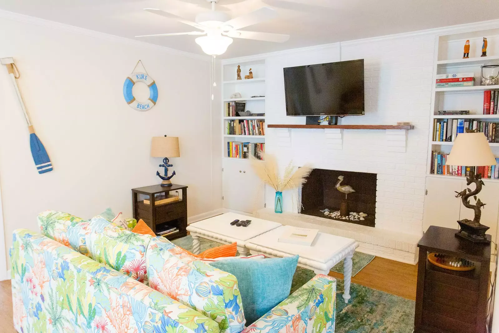 Lorraine's coastal decorations and furniture make it feel even more like the beach! The sofa also pulls out to be a queen bed.