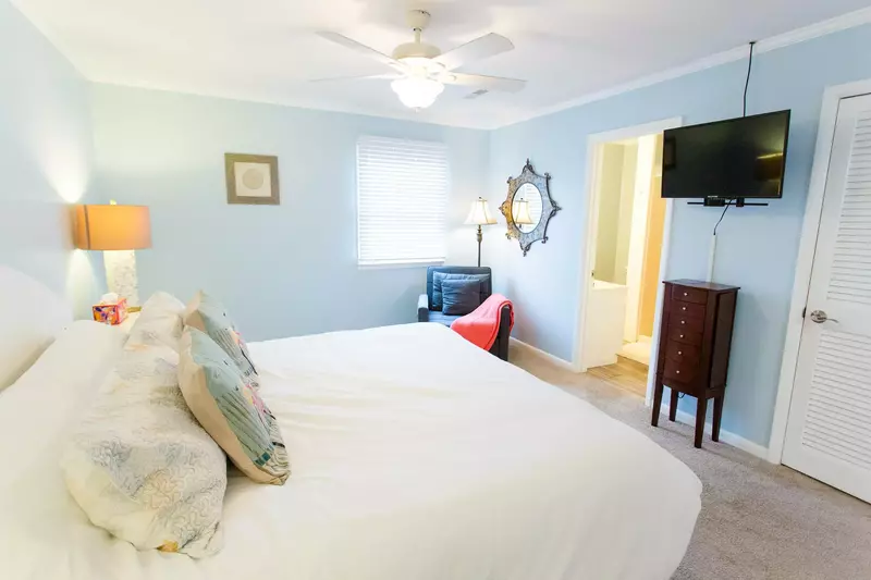 Lorraine's master also has a cozy chair for reading that pulls out to be a twin bed!