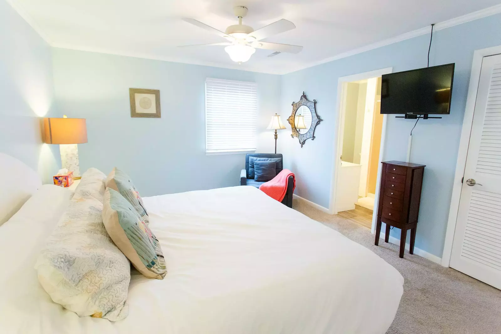 Lorraine's master also has a cozy chair for reading that pulls out to be a twin bed!