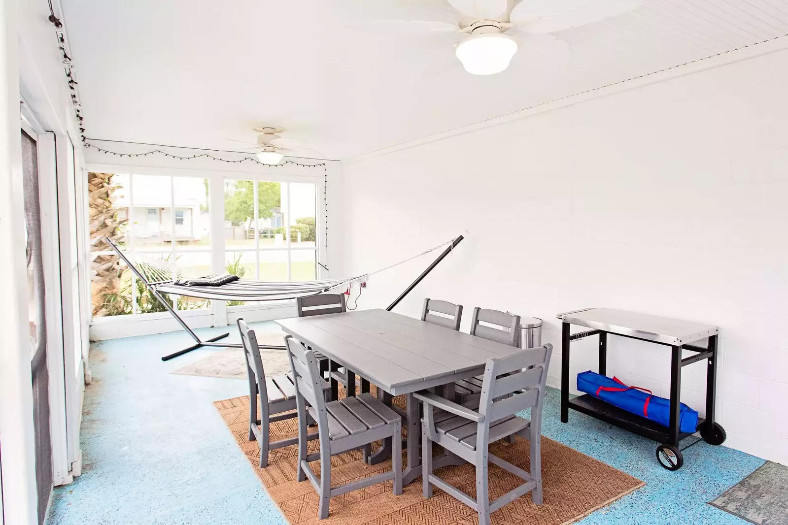 Lorraine's large screened porch has a second dining table and a hammock for maximum relaxation