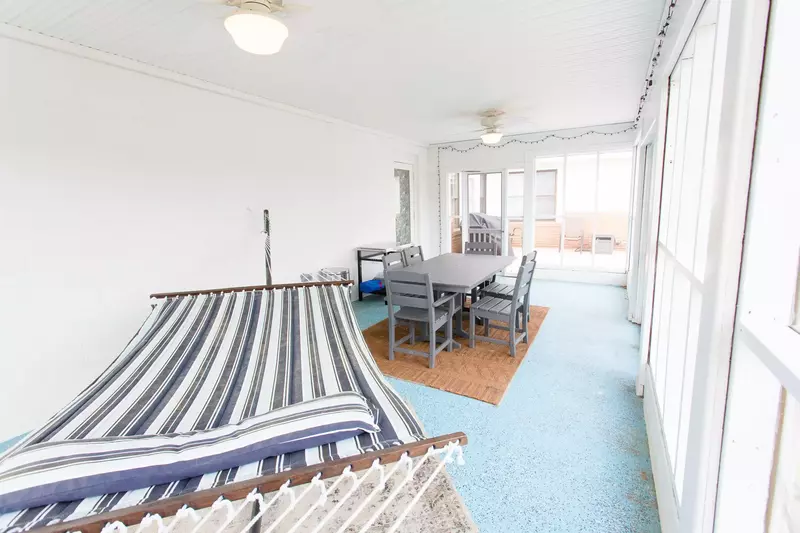 Take a nap on the hammock at Lorraine's without worrying about bugs or rain on this screened porch