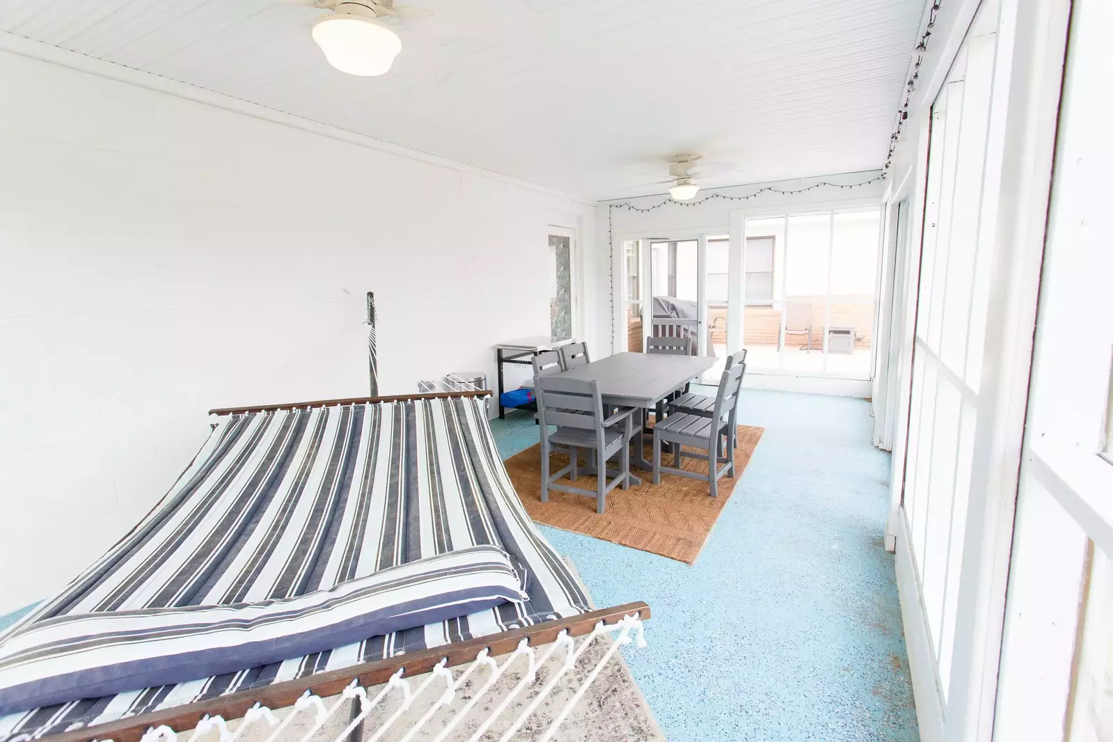 Take a nap on the hammock at Lorraine's without worrying about bugs or rain on this screened porch