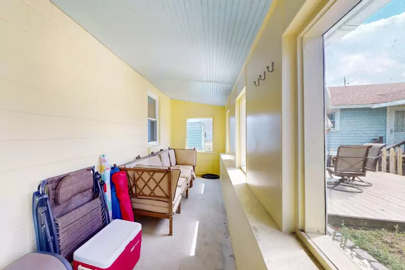 Have some quiet time on the enclosed porch at Bec's plus you can grab a cooler or chairs to use at the beach!