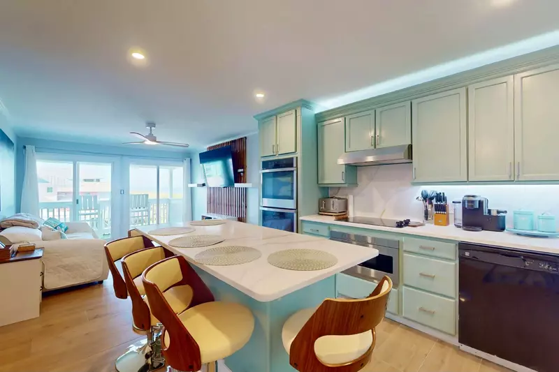 There is seating for 5 at the large kitchen island