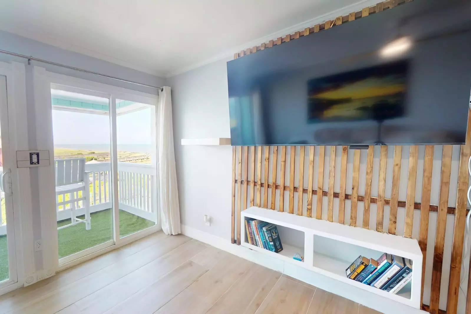 A custom wood wall and large flat screen tv offer a great spot to relax and watch the game