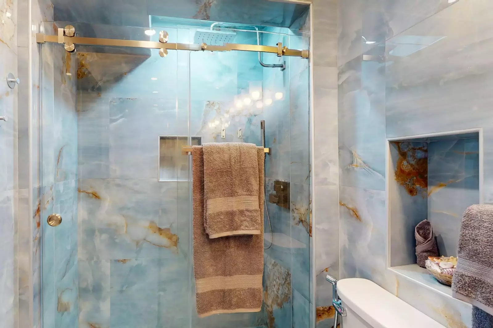The owner's ensuite has a stunning walk-in marble shower