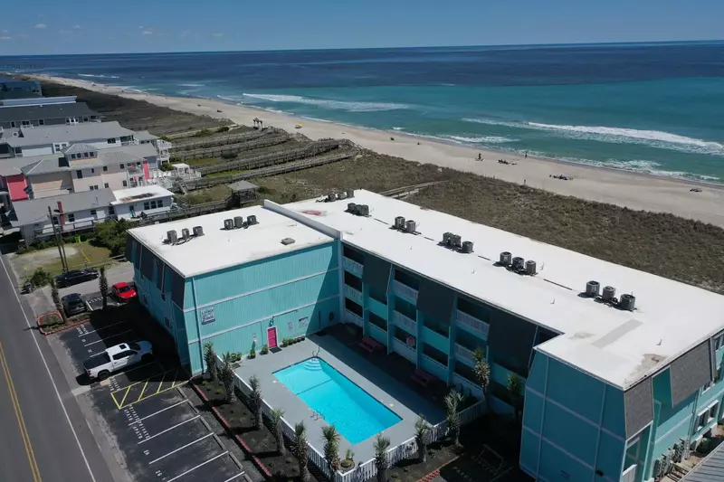 A Place at the Beach condo building and community pool