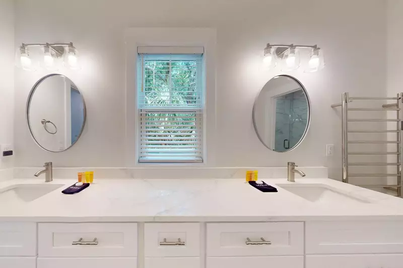 The 1st floor en-suite features a double vanity with tons of counter space