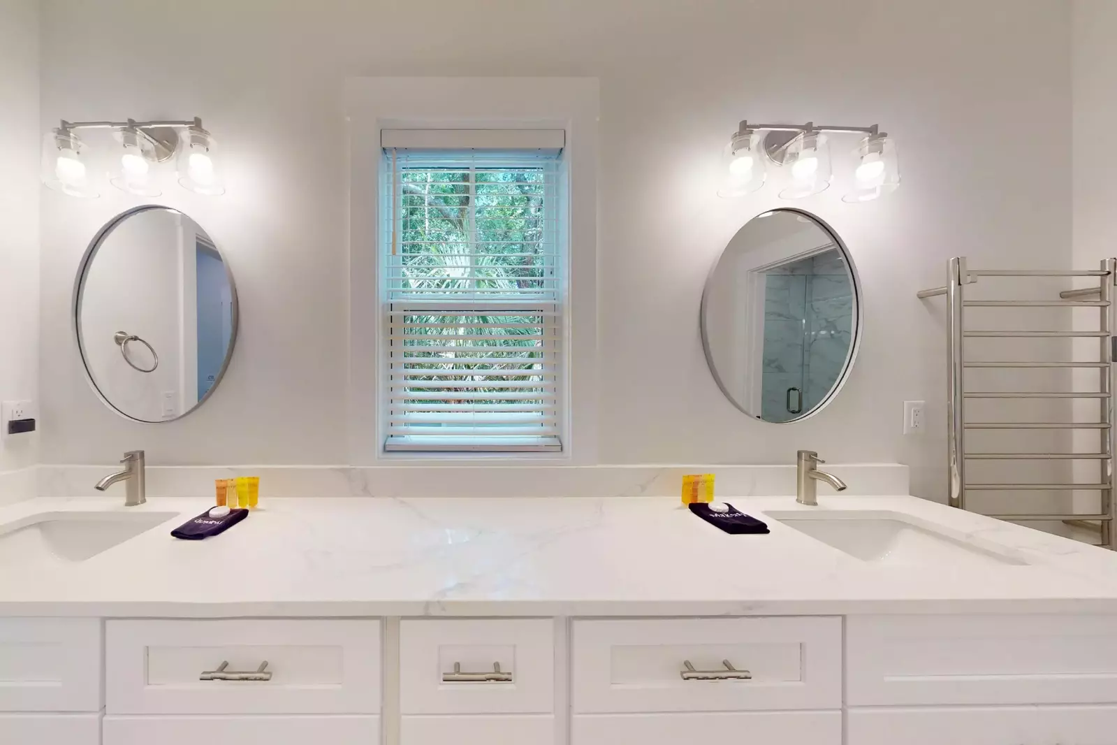 The 1st floor en-suite features a double vanity with tons of counter space