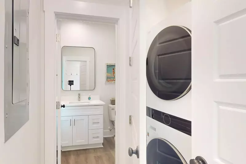 A half bathroom and washer/dryer can be found on the first floor