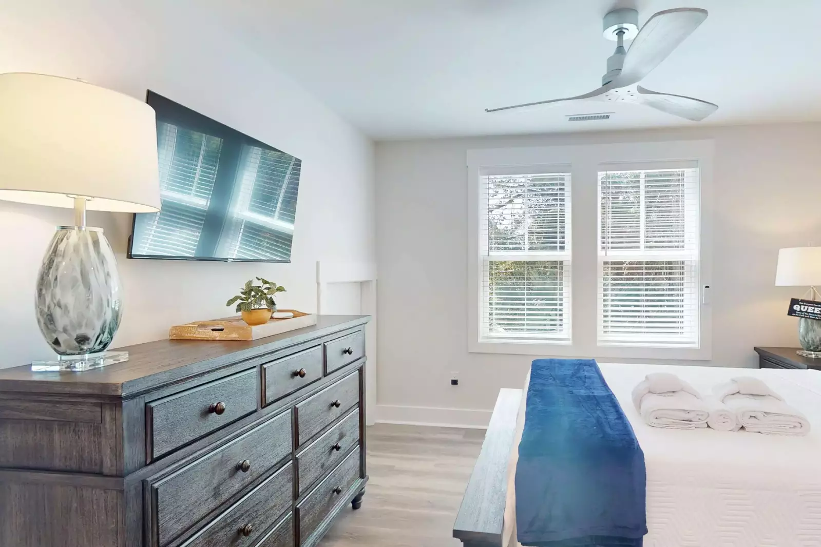 The owner's suite has tons of natural light and a wall mounted flat screen tv