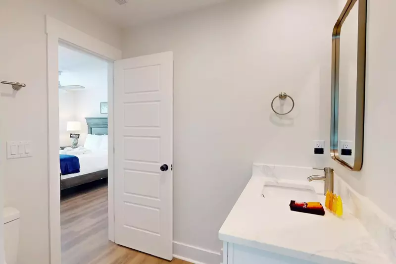 Queen bedroom private half bath that connects to the jack and jill shower