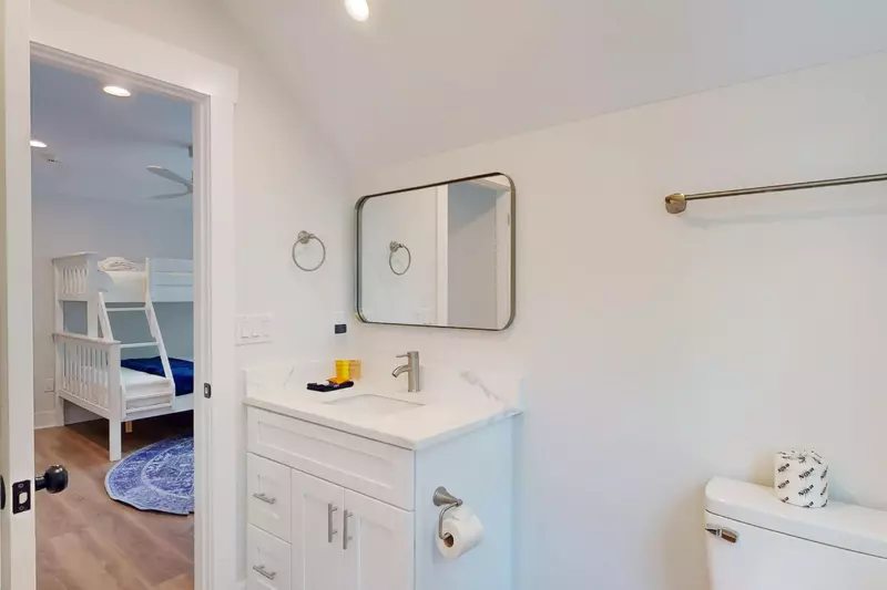 Sink and toilet portion of the upstairs full bathroom