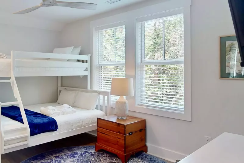 The bunk room features a twin over queen bunk bed