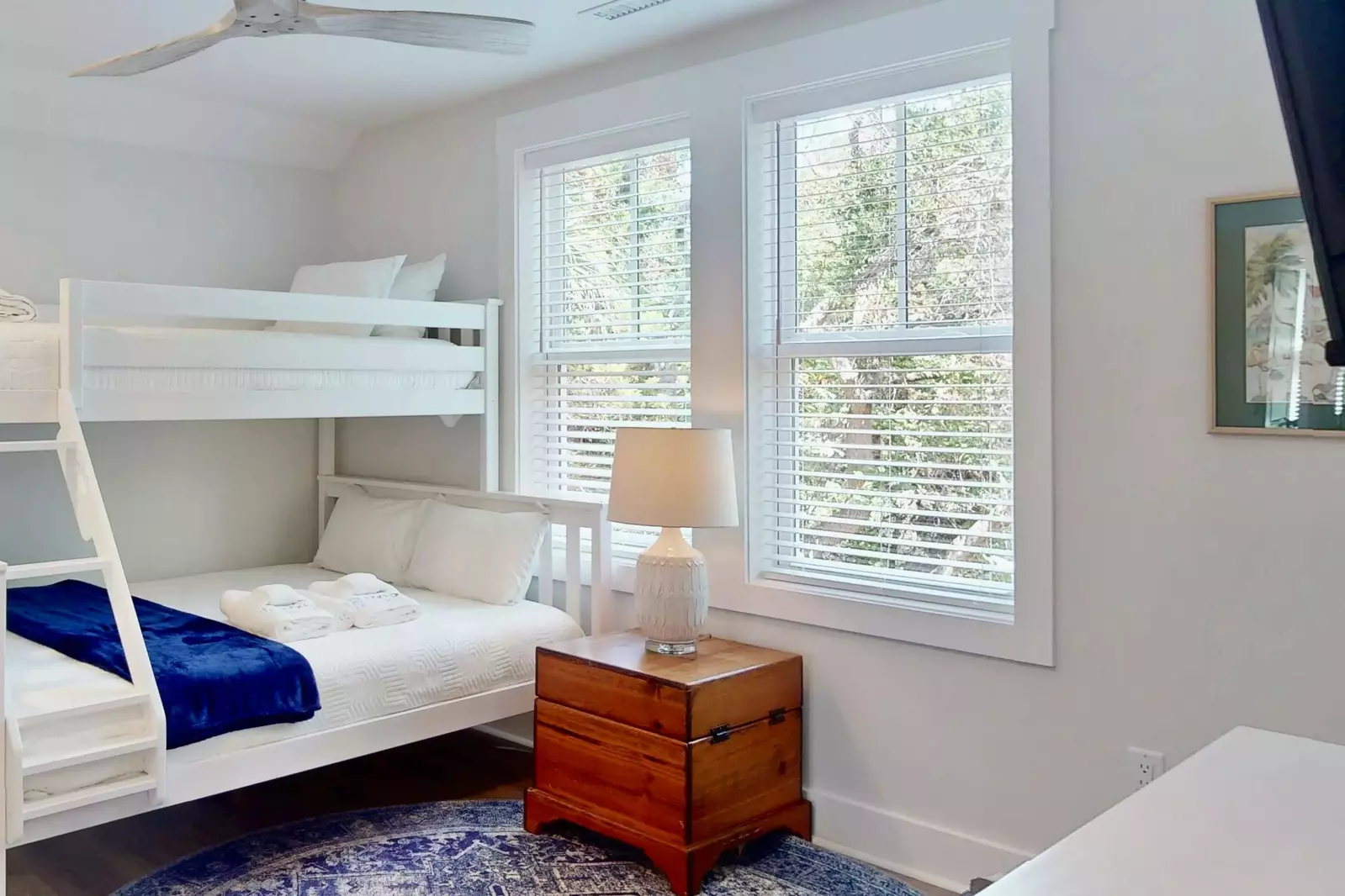 The bunk room features a twin over queen bunk bed