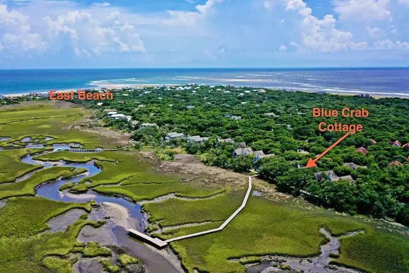 Located on the marsh, Blue Crab Cottage, is a short ride from East Beach and Shoals Club