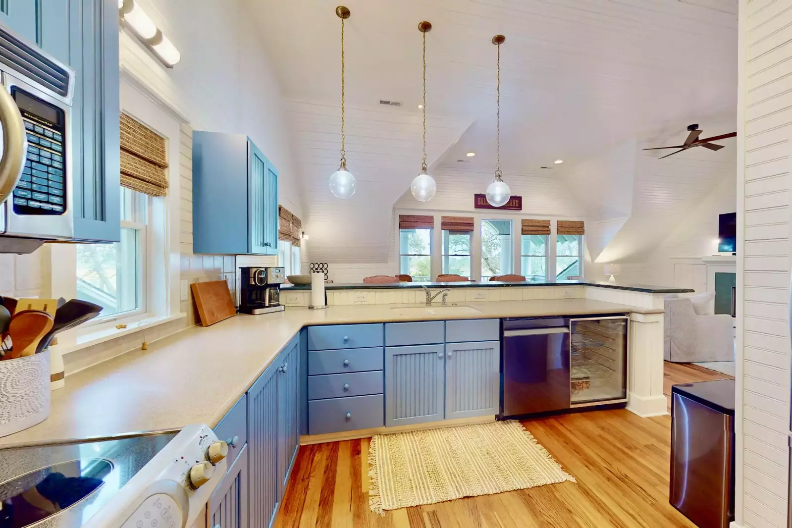 The kitchen features a good deal of counter space plus a bar top with seats