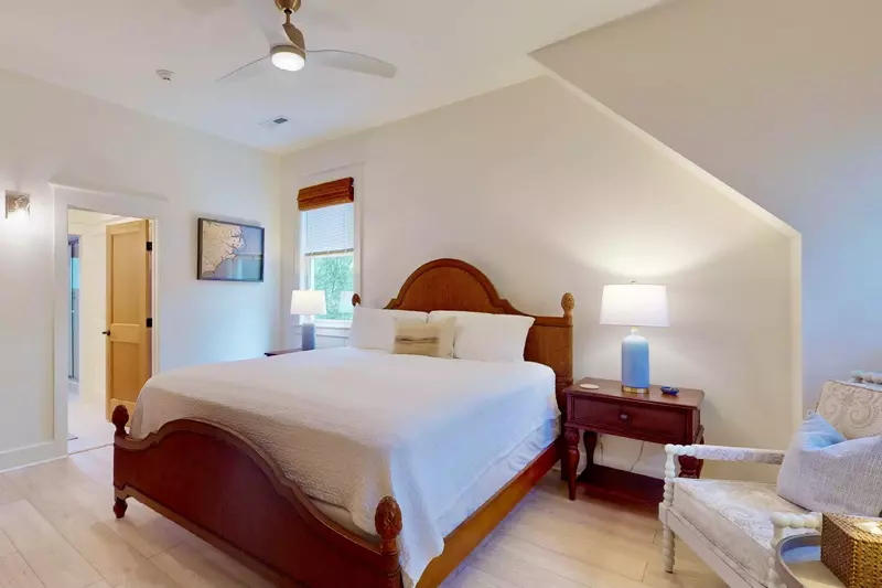 Upstairs master suite featuring a king bed, sitting area and ensuite bathroom