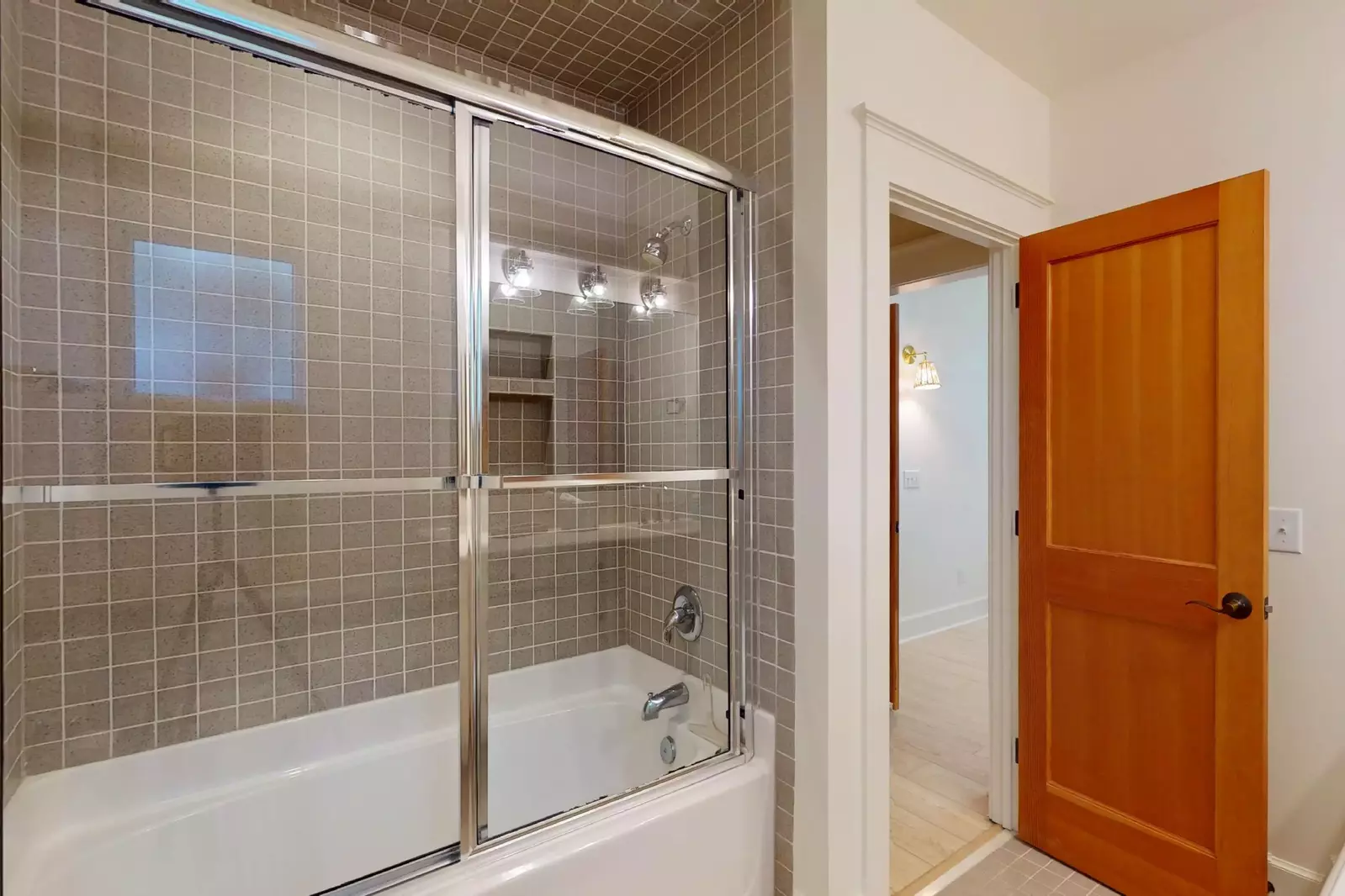 This ensuite features a tub shower combo and is attached to the twin room