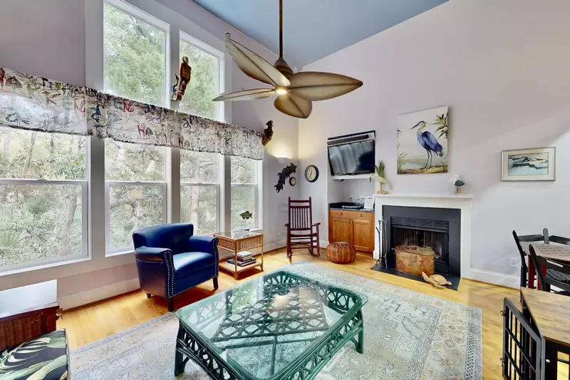 A wall of windows provides tons of natural light and the ability to bird watch from the living room