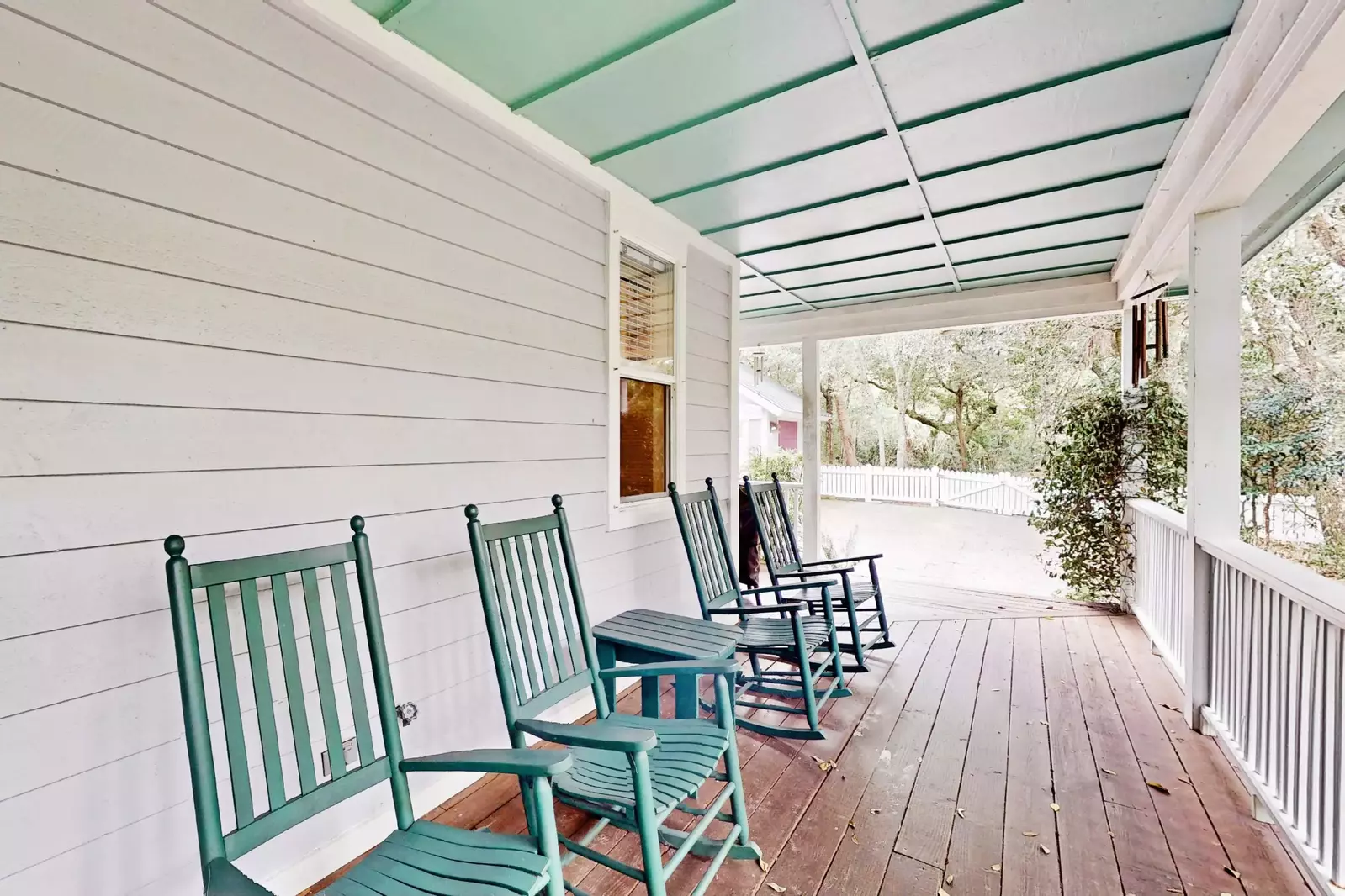 Rocking chairs on the large wraparound porch are perfect for enjoying your coffee, a book or a chat with family and friends