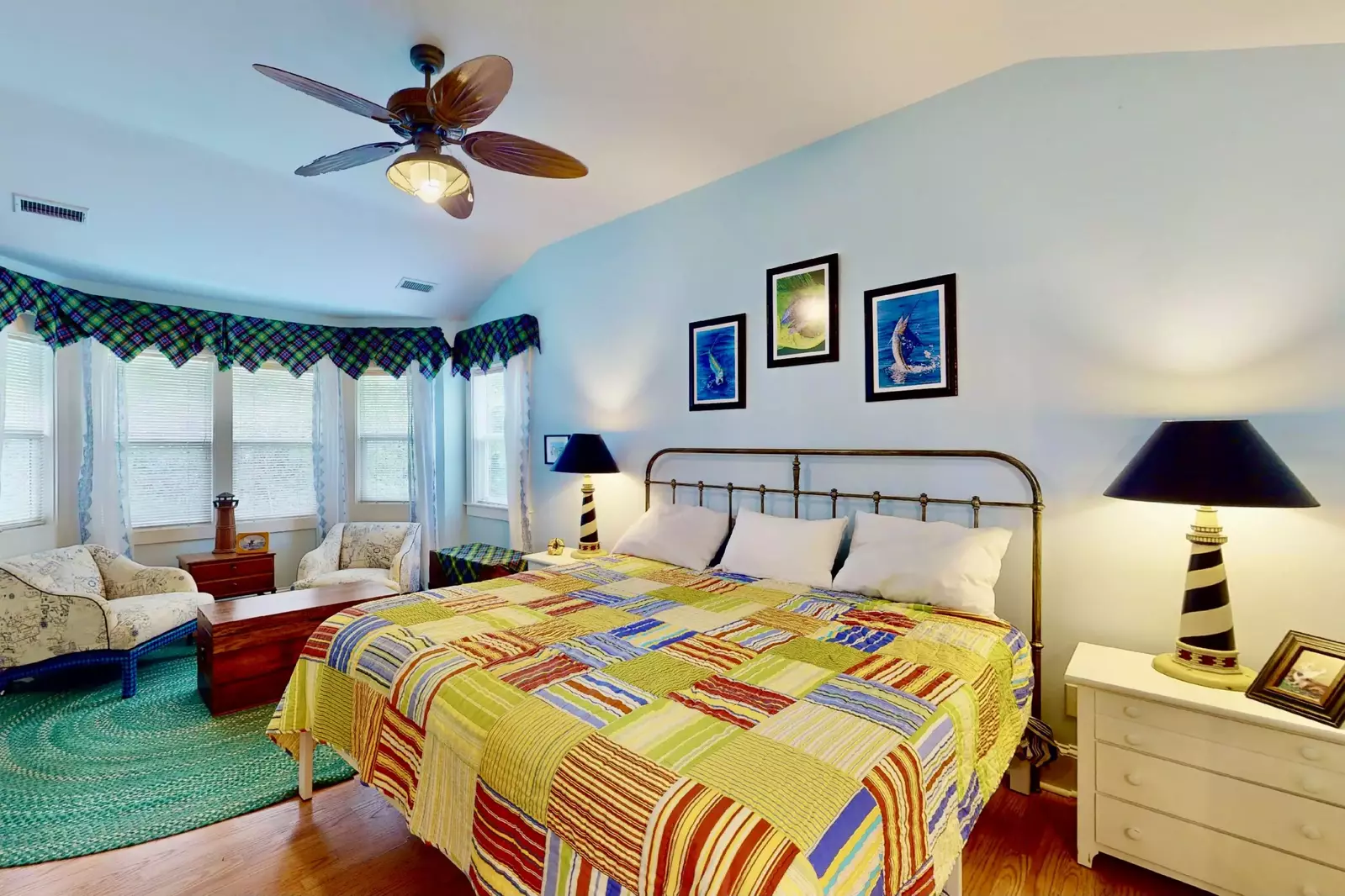 The master features a king bed, a sitting area and an ensuite bathroom