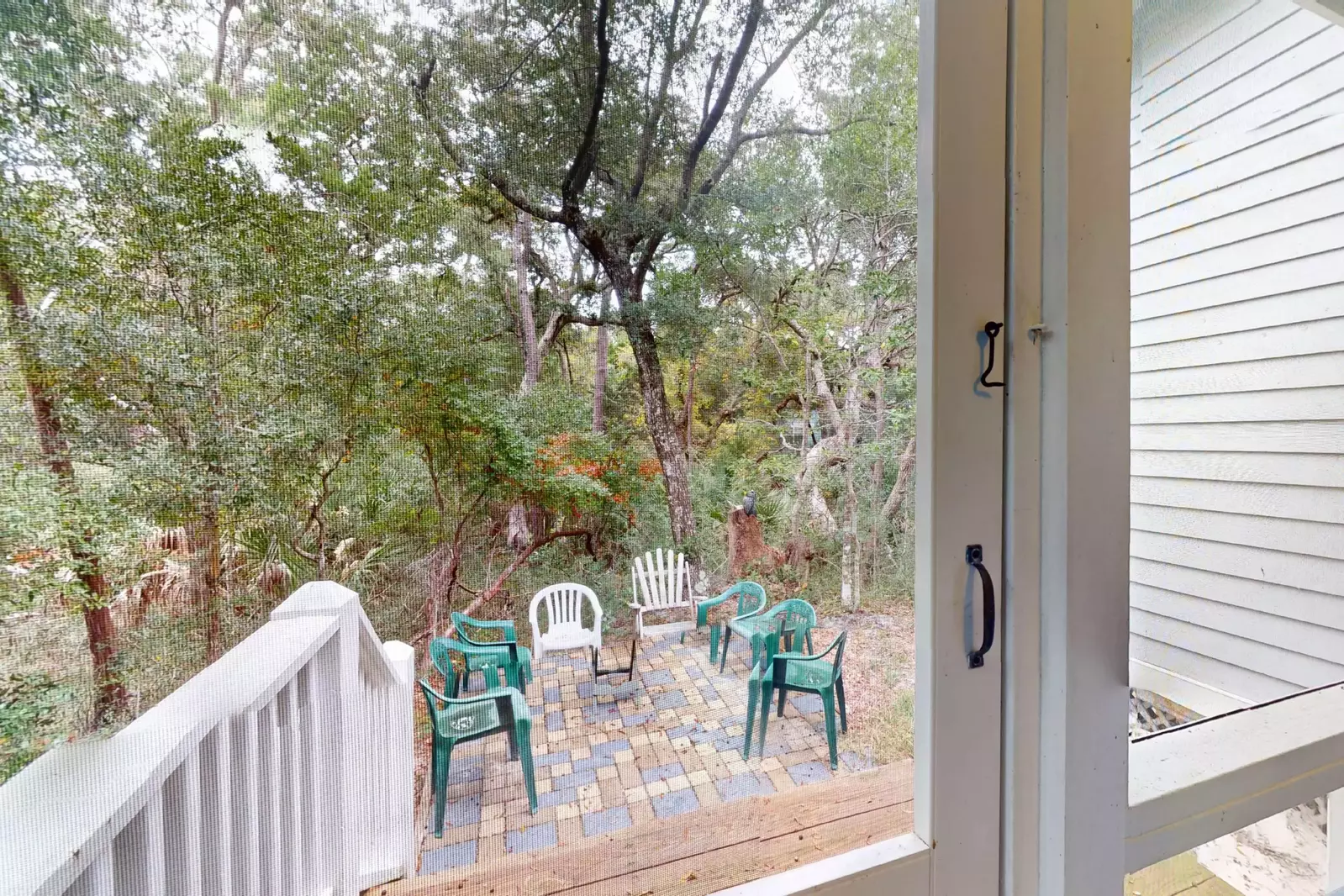 Another outdoor seating area can be found off the screened porch
