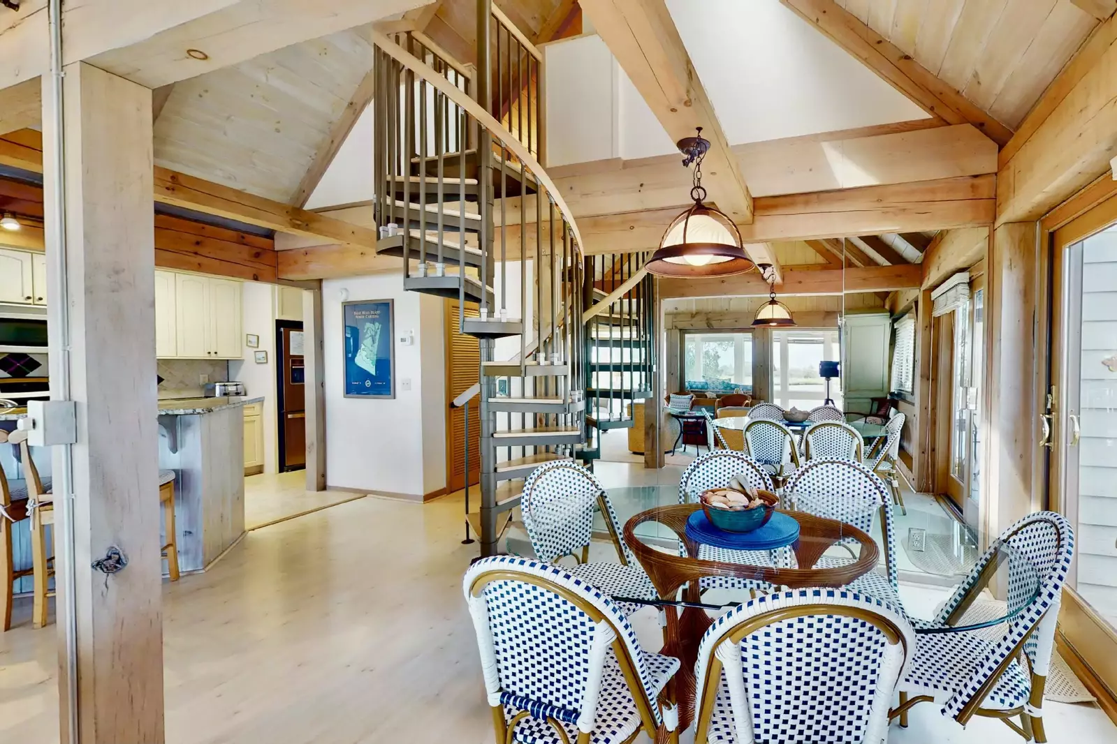 Mirrors behind the dining table allow for an even more bright and spacious feel