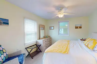 You can relax with a book in the corner reading area of this room