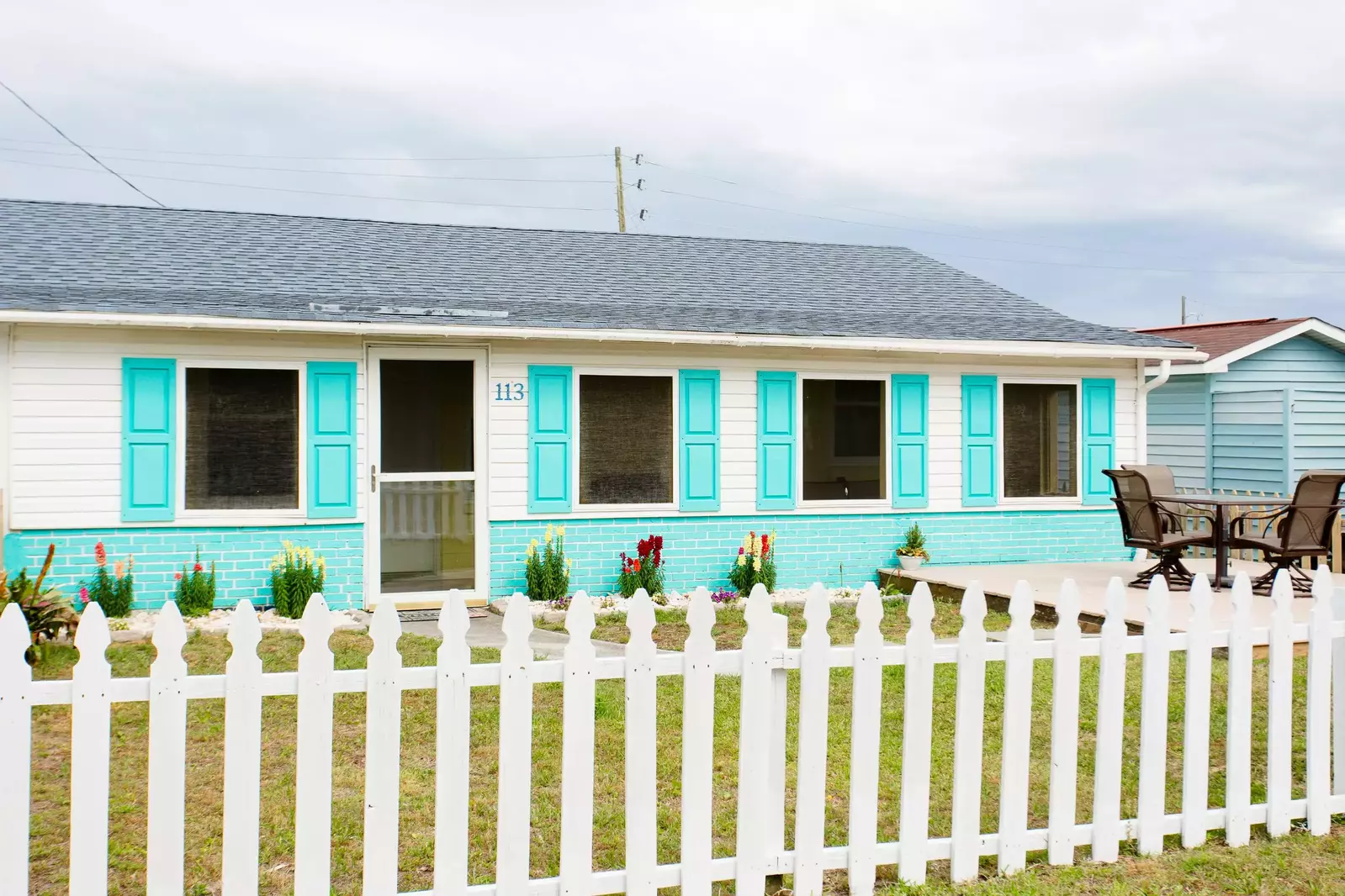 Bec's is an adorable beach bungalow with a white picket fence
