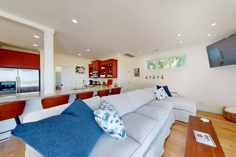 Kick back and watch the game or the river from the main living area