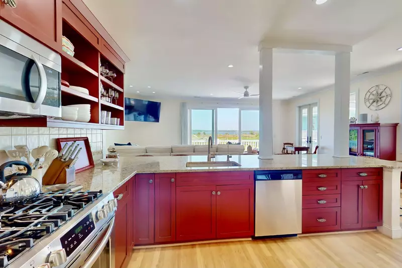 Updated appliances and everything you need to make a meal can be found in this kitchen including a view of the Cape Fear River!