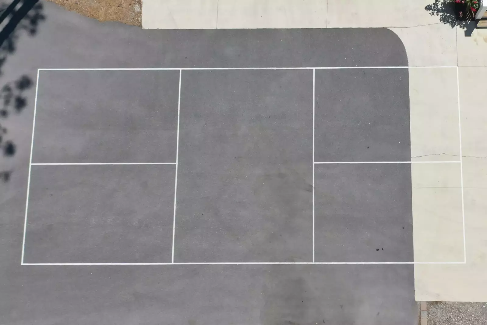 The driveway can quickly be transformed to a pickleball court!