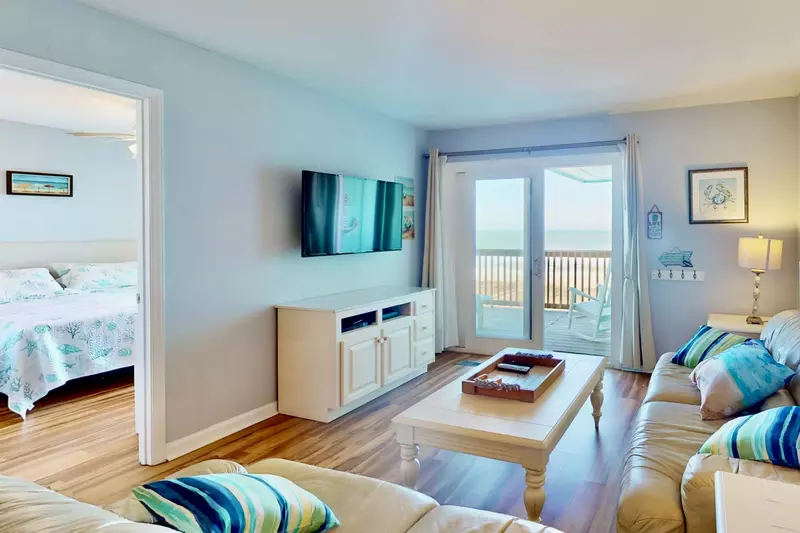 Living area features plenty of seating and a flat screen tv