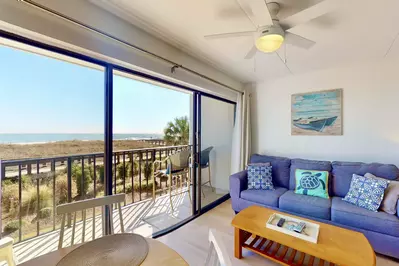 Enjoy the sounds of the ocean in this charming living area! Sofa is a queen pullout bed