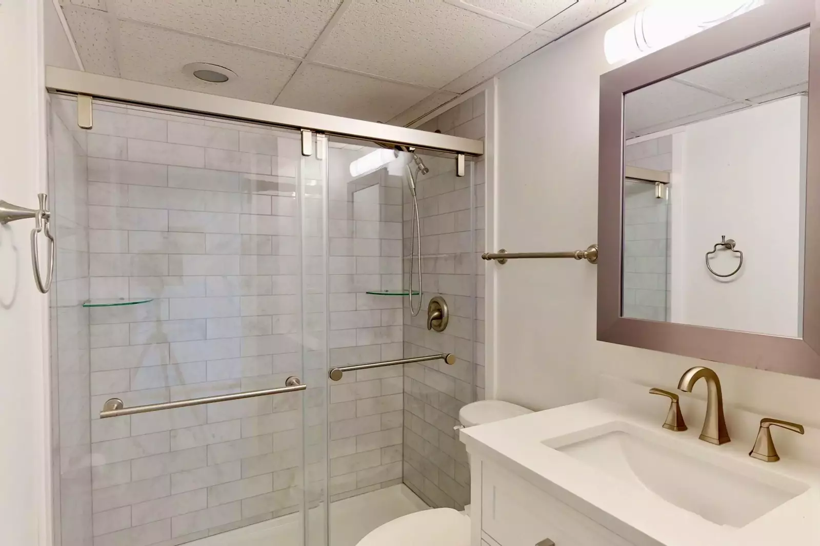 Tastefully updated bathroom with walk in tiled shower