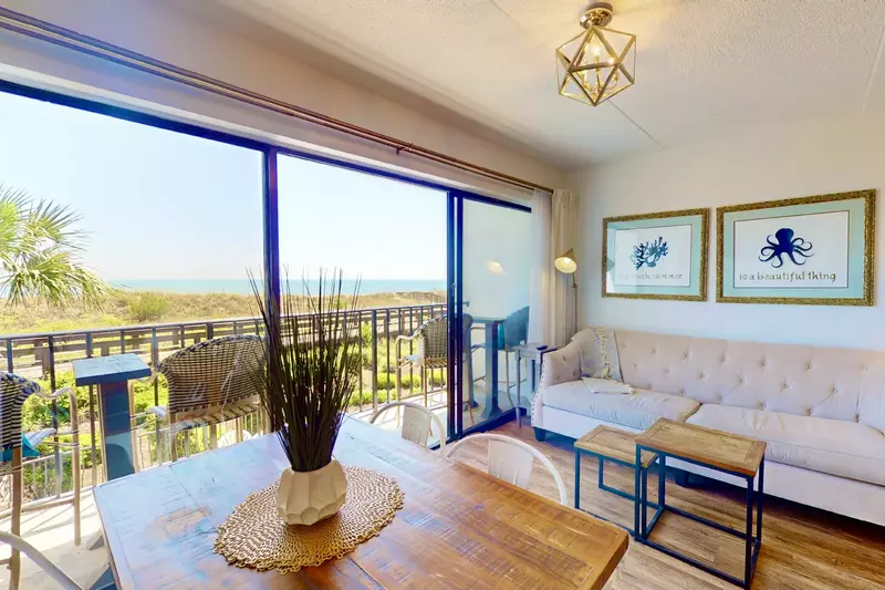 A modern light fixture and decorations add to the appeal of this oceanfront beauty