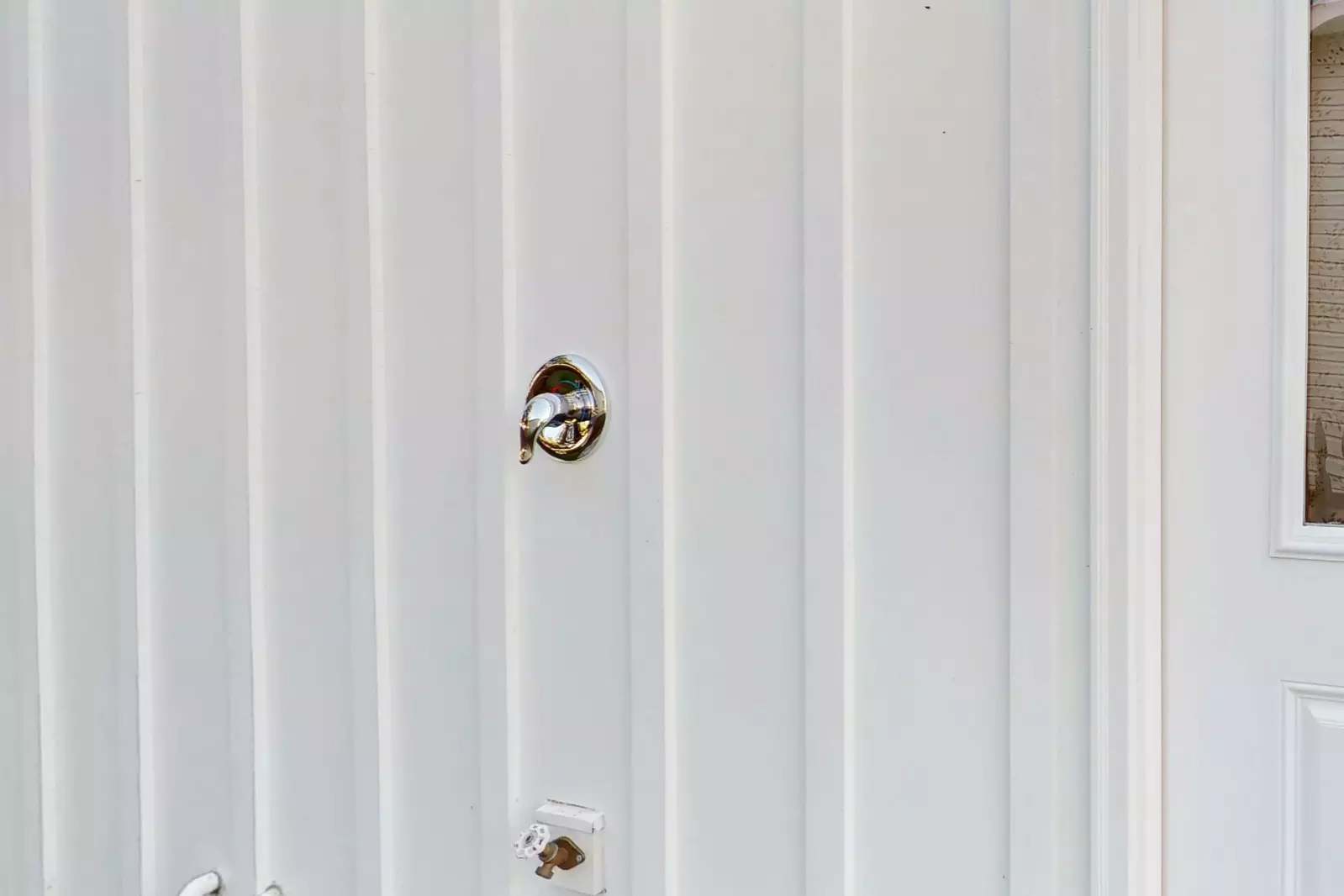 Outdoor shower to rinse off before coming back in the house