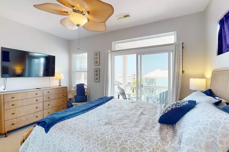 Owner suite with wall mounted flat screen tv and private deck